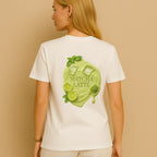 Female model in white Matcha Latte Shirt – full backprint with green matcha splash by CÉMARA
